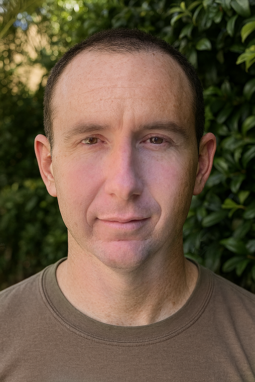 Ben from Australian Nutrition  wearing a brown shirt against a green leafy background